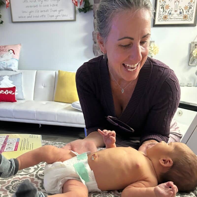 Florida craniosacral therapist with young baby in office